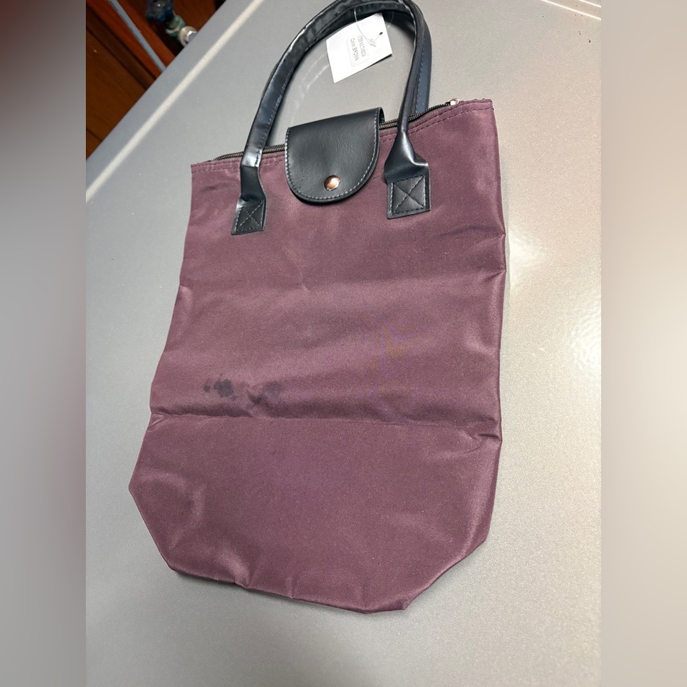 NWT ARI Travel Purse - It is able to be folded up for travel.- color Brown